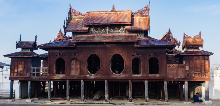 The iconic architecture of a Burmese Monastery :teak exterior and metal roofs with it's unique oval windows ,Buddha's Scripture Shwe yan pyay Monastery,Nyaungshwe,  near Lake Inle, Myanmar, Burma
