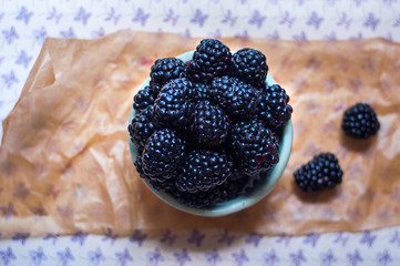 Homemade, sweet, delicious blackberries in a handmade dish 