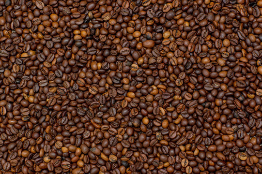 Coffee beans texture. Coffee background. Сoffee grain. Background image of many coffee beans filling the picture
