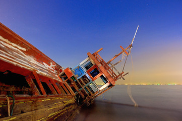 Fototapeta na wymiar Ship capsized in pattaya city