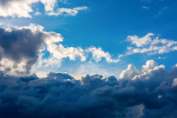 Fototapeta premium Photo of a blue sky with dark clouds