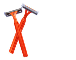 Razor in a man hand on a white background. Removal of unwanted hair. top view. Concept of using razor. Orange men's disposable razors. Shaving razor instrument.beauty, skin care concept 