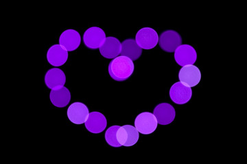 heart of colorful lights.. abstract bokeh background. heart shaped lights.
