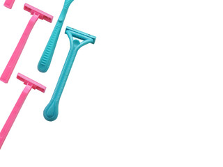 Removal of unwanted hair. top view. Concept of using razor. Shaving razor instrument. Skin care concept. Epilation hair removal. Flat lay, top view.multi-colored women's shaving razors isolated.