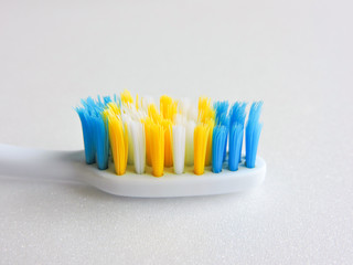 Flat lay composition with manual toothbrushes on white background.Toothbrush and toothpaste.op view, flat lay. Minimal concept, space for text.set of multicolored toothbrushes on white.