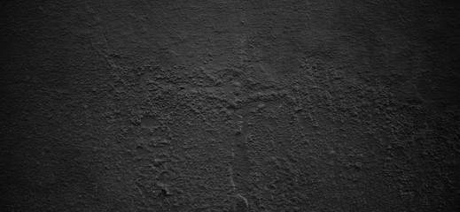 Dark panoramic background with copy space for design. Large banner. Concrete black wall surface texture