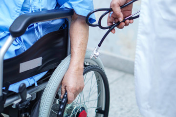 Naklejka premium Asian senior or elderly old lady woman patient on electric wheelchair with remote control at nursing hospital ward : healthy strong medical concept 