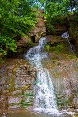Photo of high waterfall in the mountains