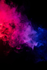 Colourful cloud of vapor. dark black background