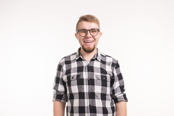 Obraz premium Study, nerd, people concept - Successful happy young handsome male student in formal outfit and glasses over the white background