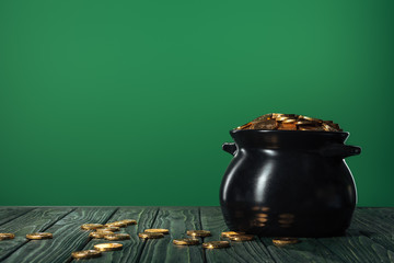golden coins in pot isolated on green with copy space, st patrick day concept - Powered by Adobe