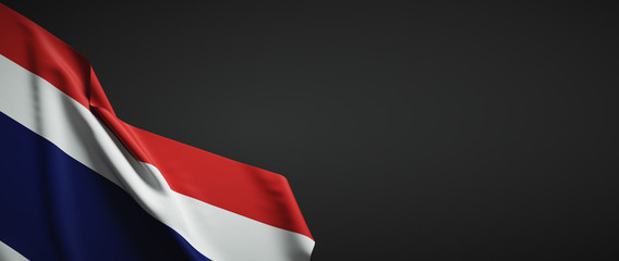 Thailand flag fabric on plain dark background