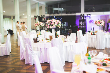 Interior of a restaurant prepared for wedding ceremony