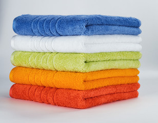 Multicolored towels on a white background