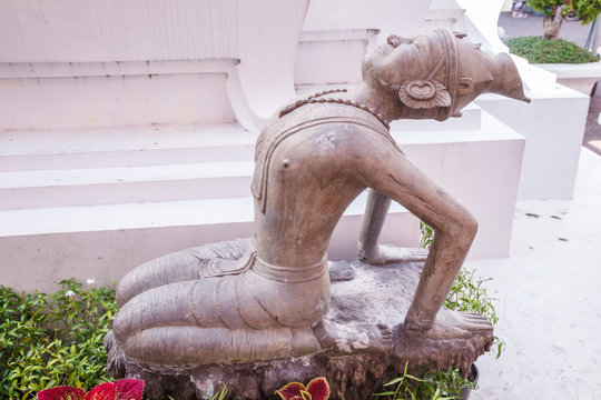 Ancient Twisted Hermit alloy statue depicts Indian yoga pose (traditional medicine and stretching movement knowledge), helping maintain health, vitality and reduce stress in Wat Pho, Bangkok, Thailand