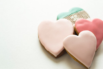 Gingerbread gingerbread in pink glaze. Bakery products. Gingerbread in the shape of a heart. Place for text.