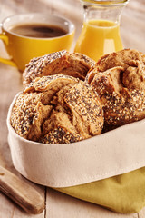Fresh bread buns, served with juice and coffee