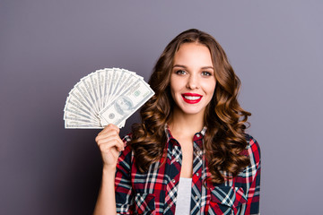 Close up portrait of beautiful amazing toothy beaming smile she her lady arm hold fan of money result of freelance internet work wearing casual checkered shirt isolated grey background