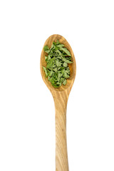 Dried green Peppermint (Mentha piperita) leaves on wooden spoon, herbal tea ingredient, isolated on white.