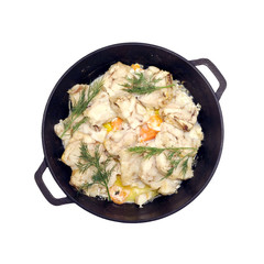 Prepared appetizing fried white fish fillet with carrot and dill on black round iron pan isolated on white background studio shot  top view