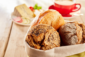 Freshly baked buns of bread served in fabric bag