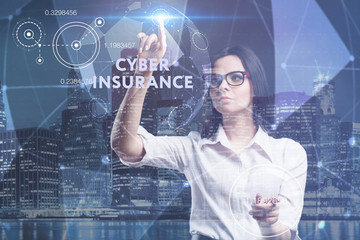 The concept of business, technology, the Internet and the network. A young entrepreneur working on a virtual screen of the future and sees the inscription: Cyber insurance