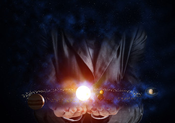 Businessman presenting solar system.