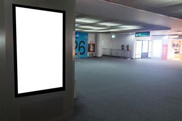 Fototapeta na wymiar mock up of vertical blank advertising billboard or light box showcase with people waiting at airport, copy space for your text message or media content, advertisement, commercial and marketing concept