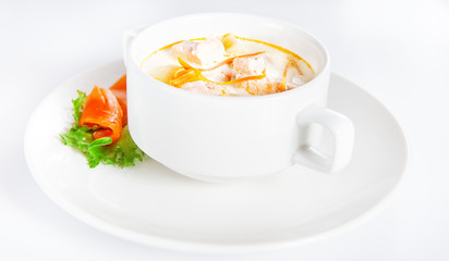 Delicious creamy soup with salmon on white
