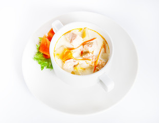 Delicious creamy soup with salmon on white