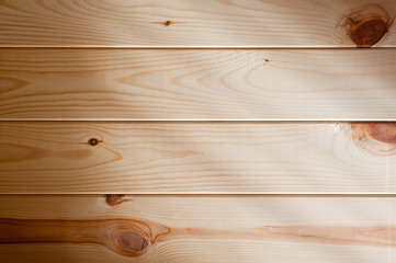 Panel of wooden planks with rays of light falling on it