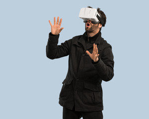 young man using virtual reality glasses