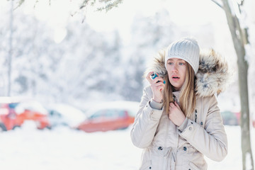 Woman with Inhaler Suffering Asthma Attack in Winter Asthmatic patient managing condition with...