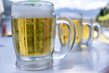 glass of beer on wooden background