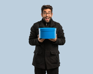 young man holding a box