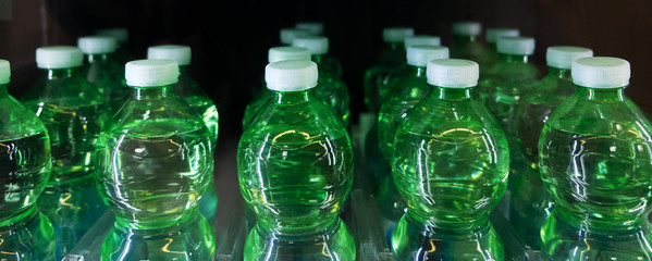 green bottle water details inside the automatic machine.