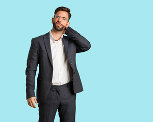 Young handsome business man suffering neck pain