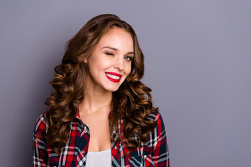 Close-up portrait of nice cute sweet attractive charming pretty winsome cheerful wavy-haired lady winking one eye isolated over gray pastel background