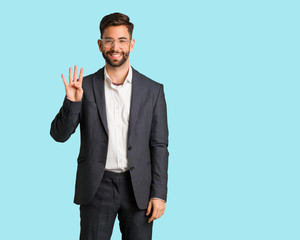 Young handsome business man showing number four