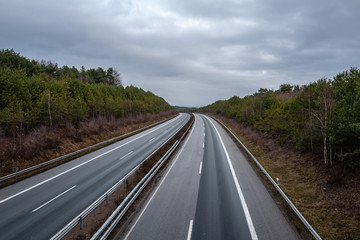 empty german highway on a dark grey morning