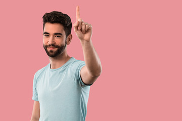 Fototapeta premium young man doing number one gesture