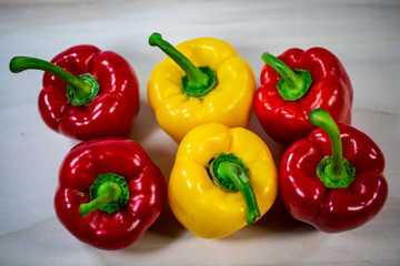 yellow and red peppers in a row