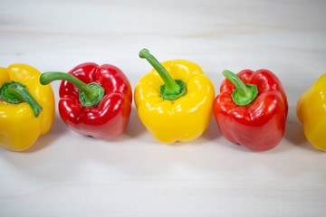 yellow and red peppers in a row