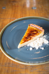 custard tart on blue plate