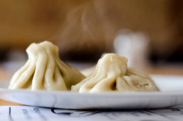 khinkali cooked on a ceramic plate