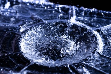 Water drops splashing on acoustic membrane. A lot of drops in air. High frequency of sound waves....