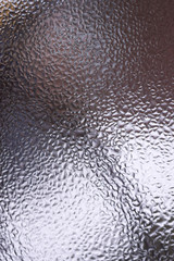 Water drops on glass window close up with blurred background. Drops in macro. Condensate on window closeup. Wet air.
