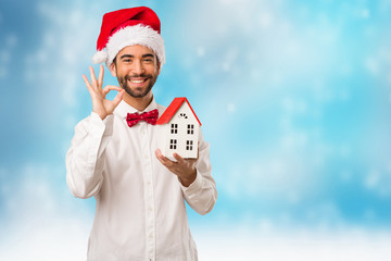 Young man wearing a santa claus hat on Christmas day