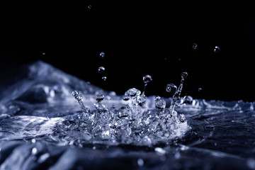 Water drops splashing on acoustic membrane. A lot of drops in air. High frequency of sound waves....