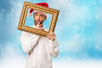 Young man wearing a santa claus hat on Christmas day
